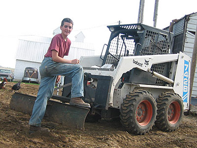 Daniel enjoyed learning how to drive the Bobcat, too